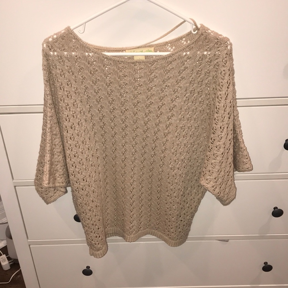 Cream colored short sleeve knit sweater